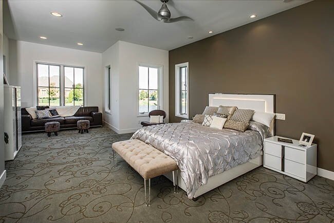 Bedroom with large bed and couch