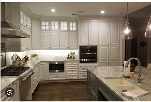 Kitchen with white cabinets and island